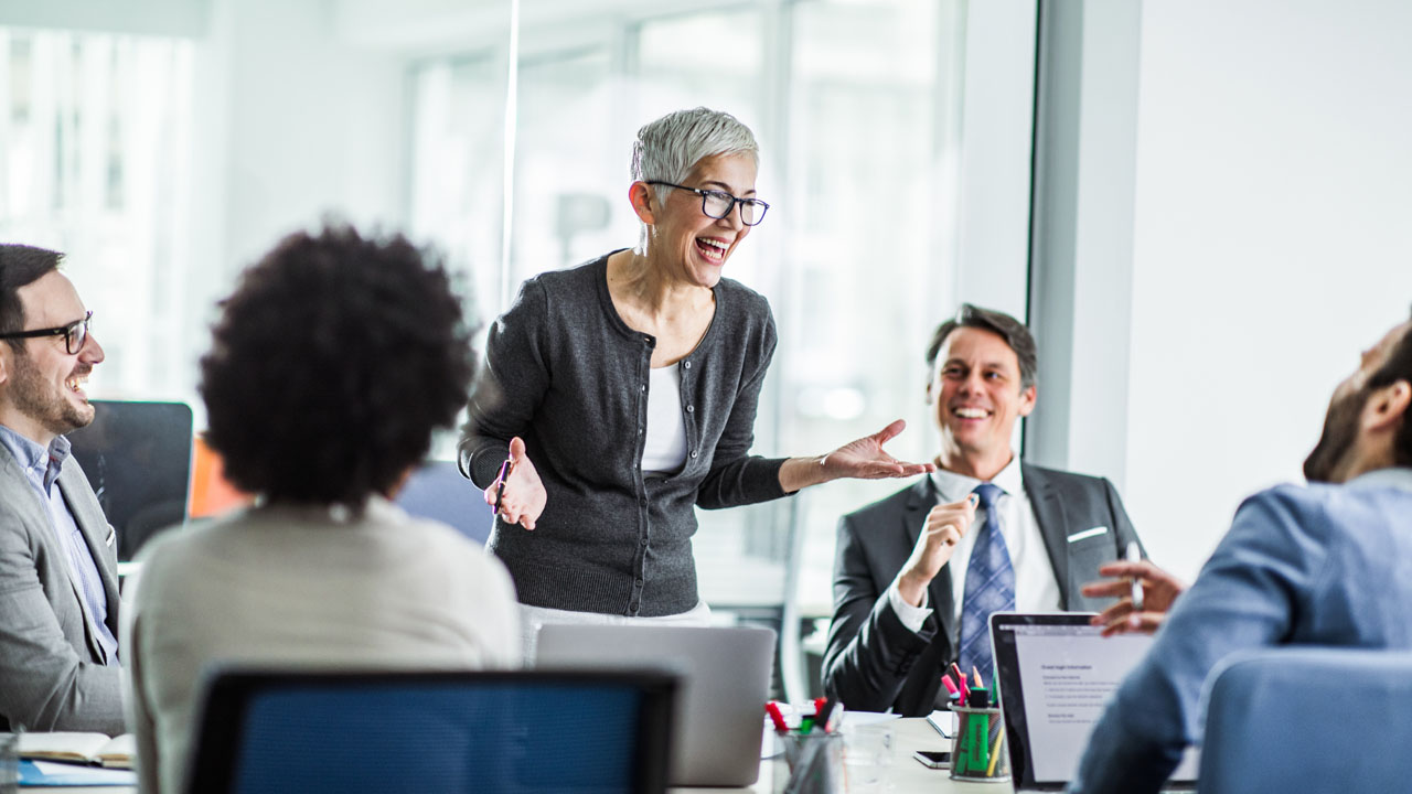 financial advisor smiling in meeting